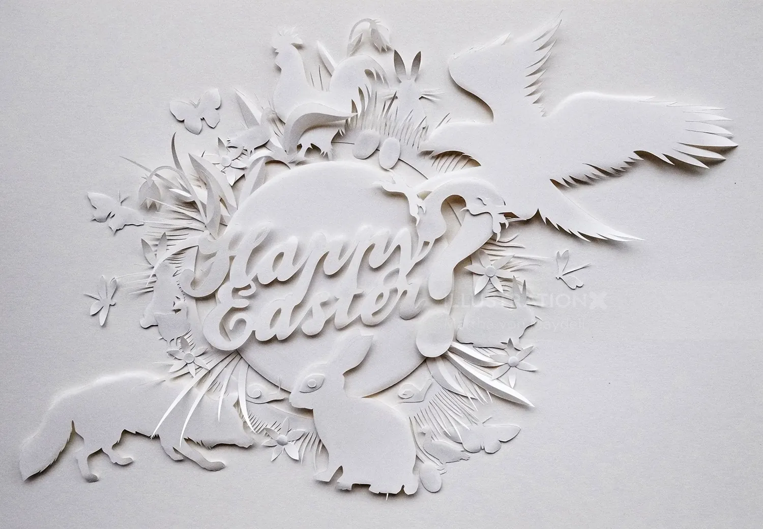 White paper cutout with flowers, birds, and Happy Easter text by Martha von Maydell