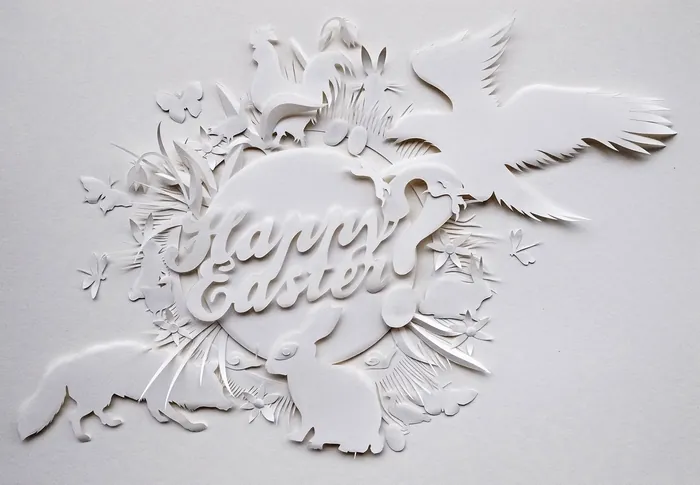 White paper cutout with flowers, birds, and Happy Easter text by Martha von Maydell