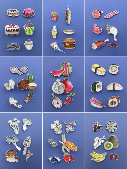 Enamel pins of food, fruits, flowers, and animals by Martha von Maydell
