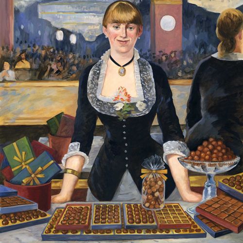Woman in black dress standing behind table with chocolates and gifts