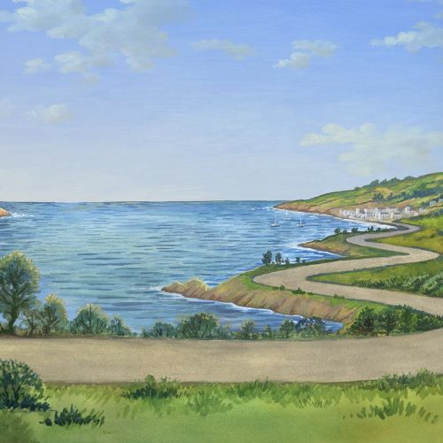 Coastal scene with winding road, greenery, and calm sea under blue sky.