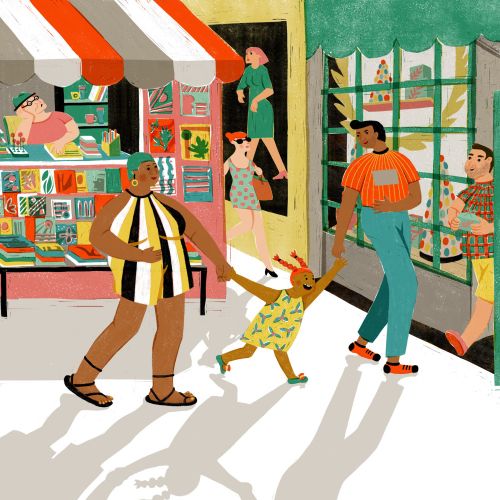 People walking and window shopping on a sunny street with shops