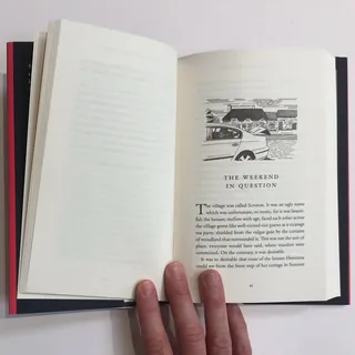 Open book page titled 'The Weekend In Question' with village illustration, by Matt Hollings