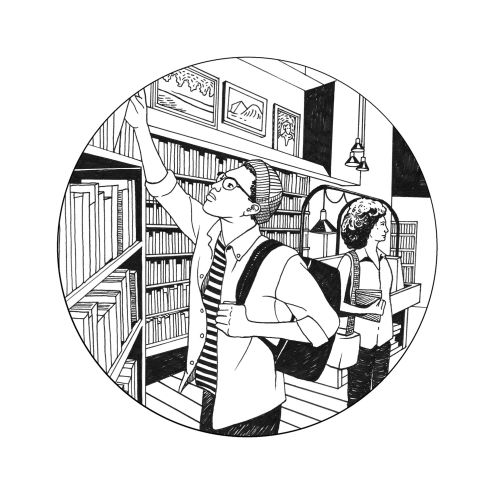 Two students browsing books on high shelves in a library