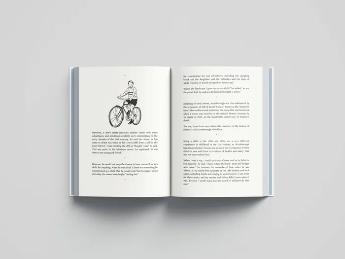 Open book showing pages of text and a bicycle rider illustration