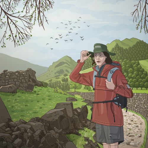 Hiker adjusting hat on mountain trail with green hills and stone walls