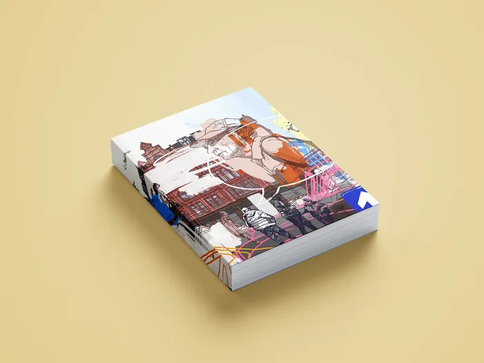 Stack of art books with vibrant urban illustrations on beige surface