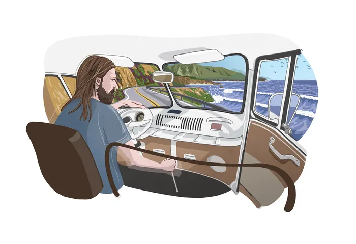 Man driving camper van with ocean cliffs and waves outside window