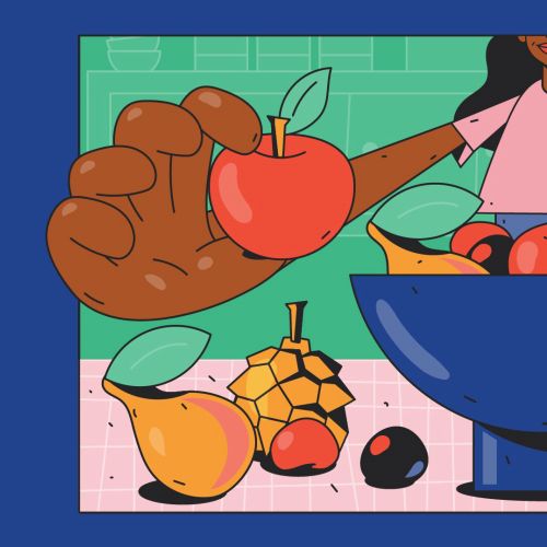 Person holding apple next to bowl of various fruits on table