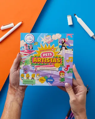 Person holding Pets Artists board game box with colorful design