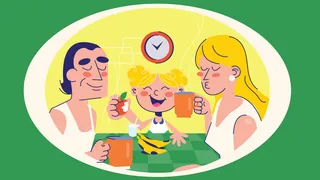 Family of three drinking coffee and smiling around a table