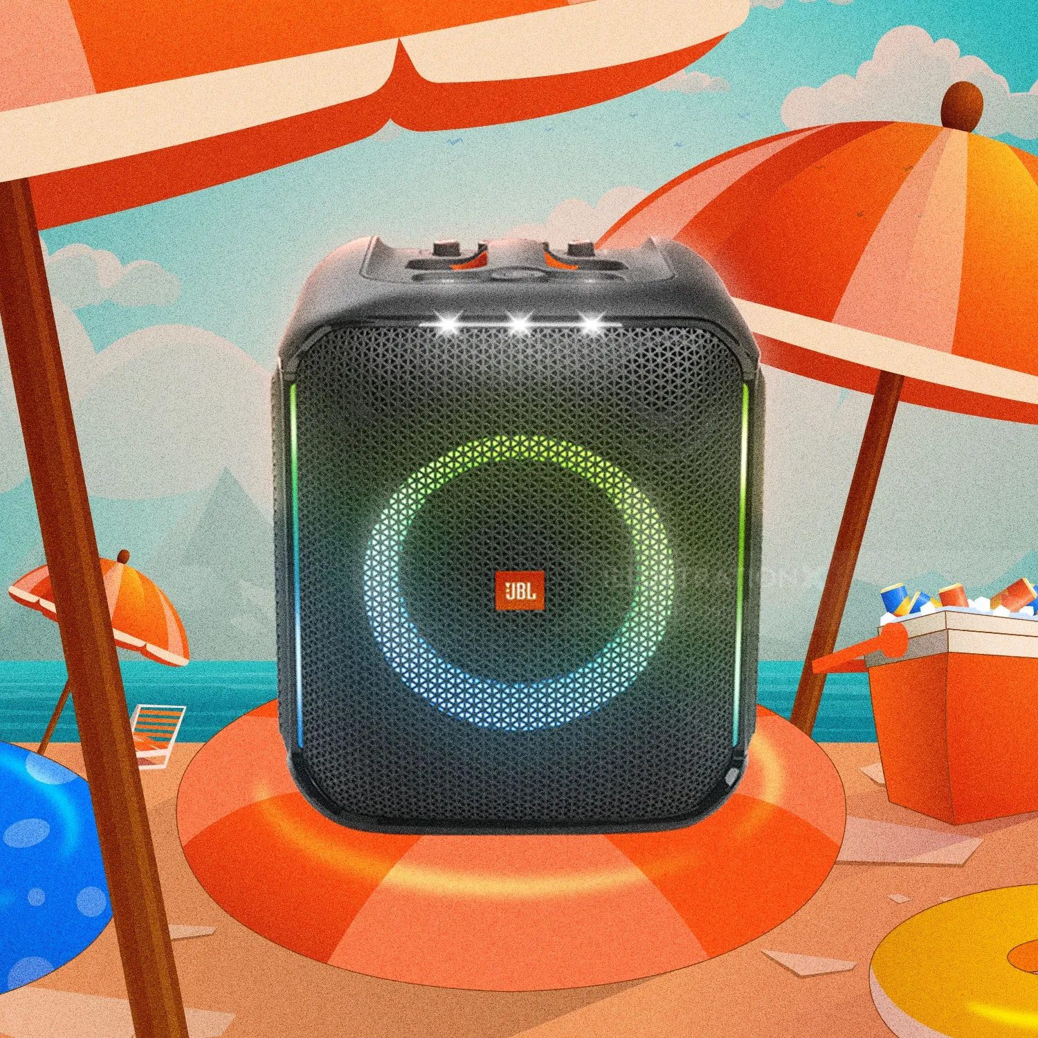 JBL portable speaker with multicolor LED lights on a beach