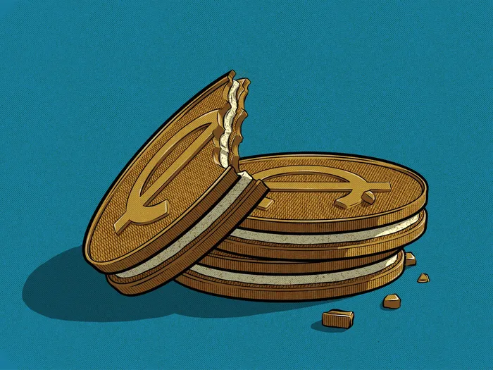 Stacked cream sandwich cookies with a bite and crumbs by Max Erwin