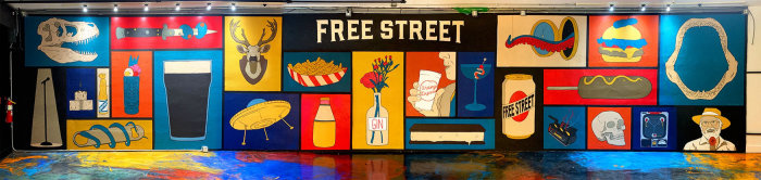 La peinture murale du Free Street Pub a pour thème la nourriture et les boissons