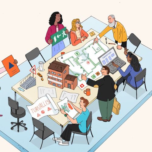 Eine Gruppe arbeitet gemeinsam an Architekturplänen an einem Tisch.