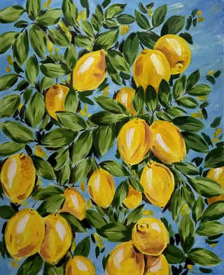 Branch with ripe yellow Italian lemons and green leaves