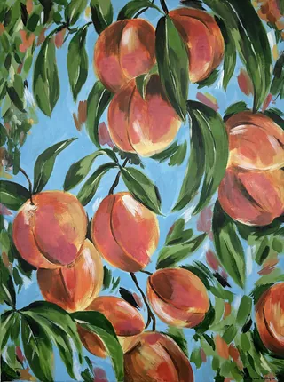 Ripe peaches on tree branches with green leaves and blue sky