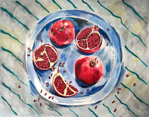 Pomegranates arranged on a blue plate on striped cloth by May van Millingen