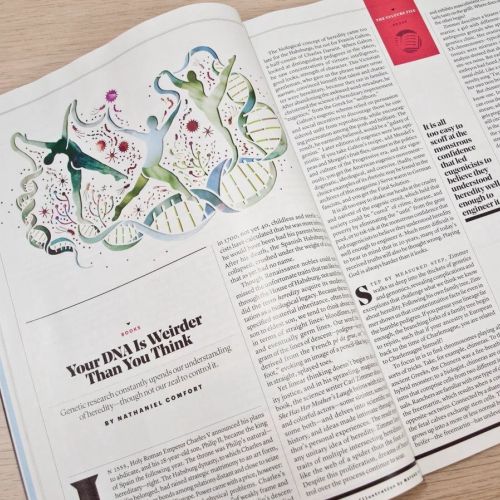 Open magazine featuring DNA illustration and article text