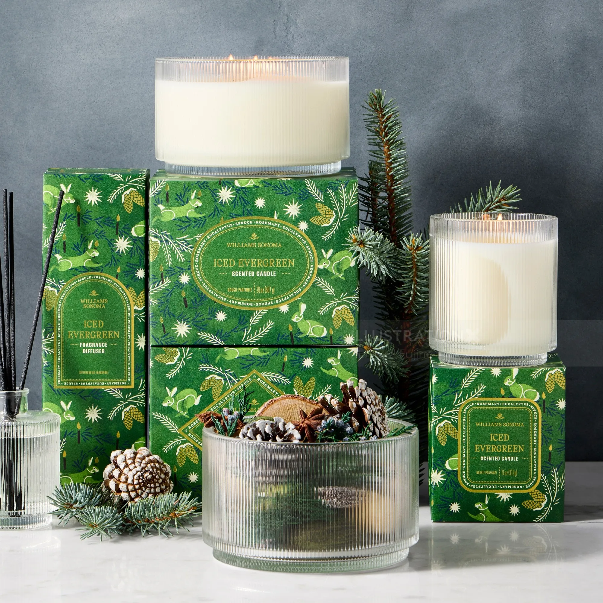 Iced Evergreen scented candles and green packaging with pine cones