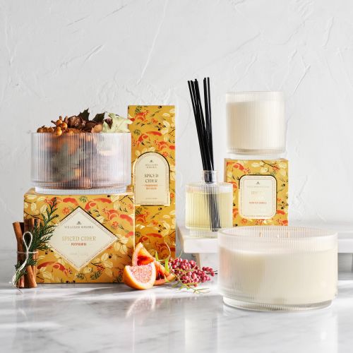 Spiced cider scented candles and reed diffuser with autumn decor