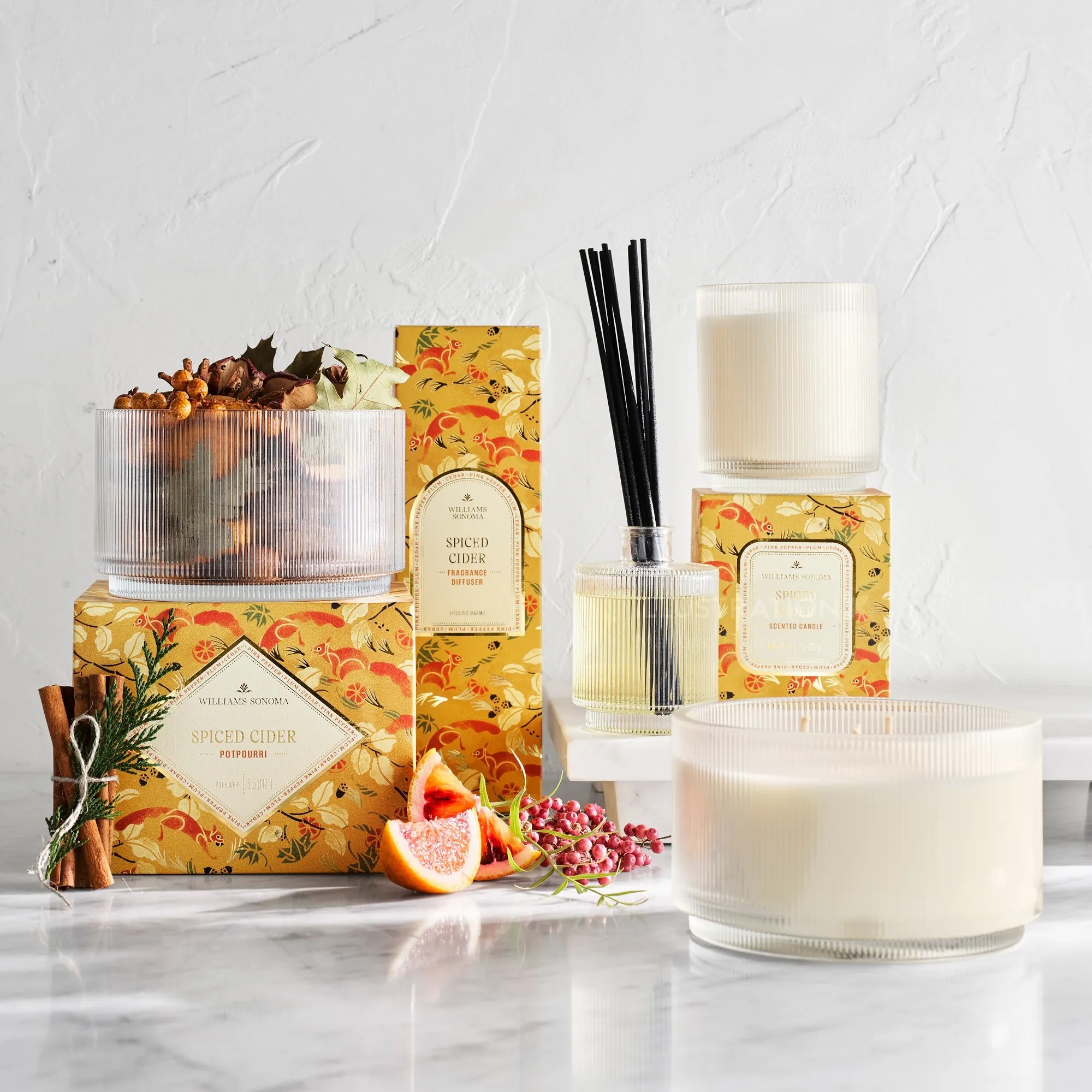 Spiced cider scented candles and reed diffuser with autumn decor