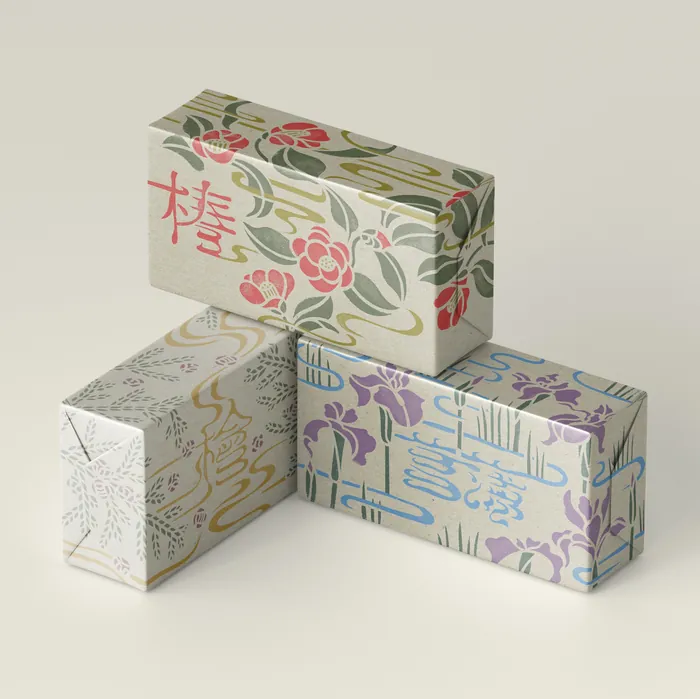 Hand-painted soap boxes with floral and Japanese character designs