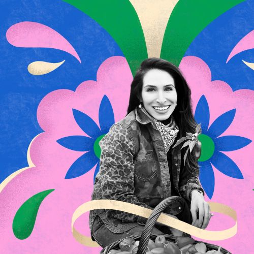 Portrait of a smiling woman in front of colorful floral design by Mel Cerri