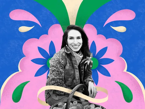 Portrait of a smiling woman in front of colorful floral design by Mel Cerri