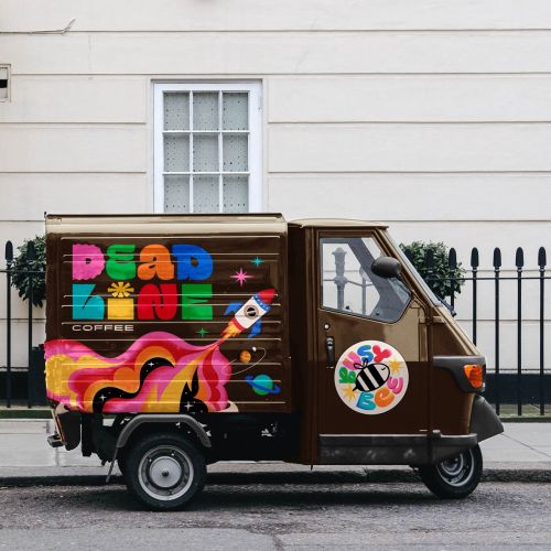 Deadline Coffee delivery truck with vibrant colorful logo and design by Mel Cerri