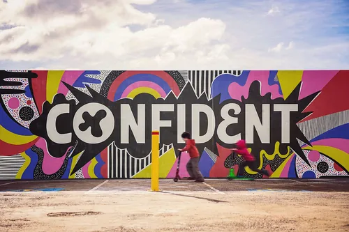 Mural with colorful CONFIDENT lettering by Mel Cerri