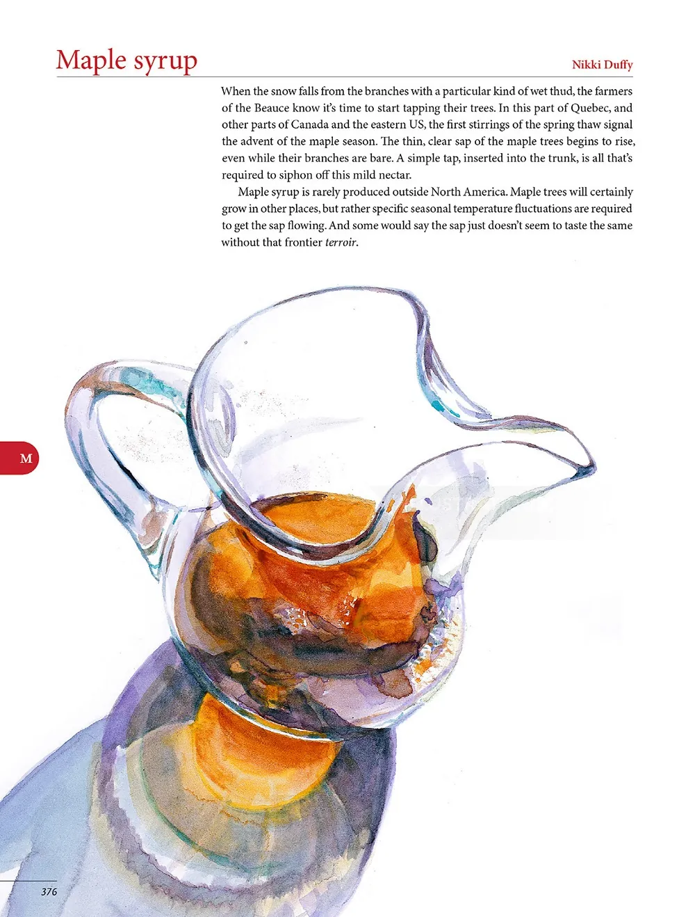 Glass pitcher filled with maple syrup against white background by Michael Frith