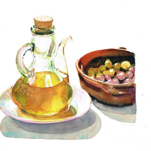 Glass bottle with olive oil next to a bowl of green and purple olives