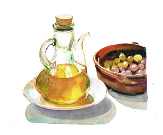 Glass bottle with olive oil next to a bowl of green and purple olives