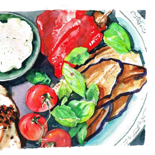 Plate with grilled vegetables, cherry tomatoes, and a bowl of dip