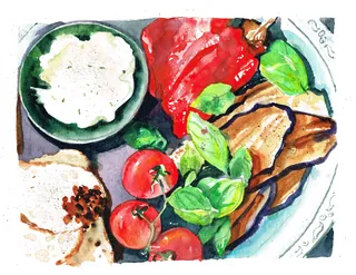 Plate with grilled vegetables, cherry tomatoes, and a bowl of dip