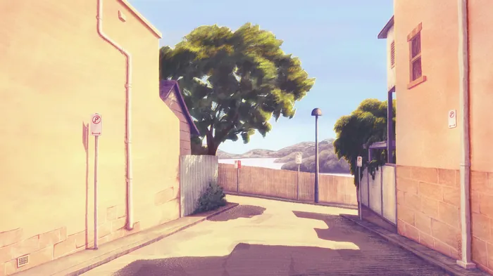 Quiet sunlit alley with No Parking sign and tree in background