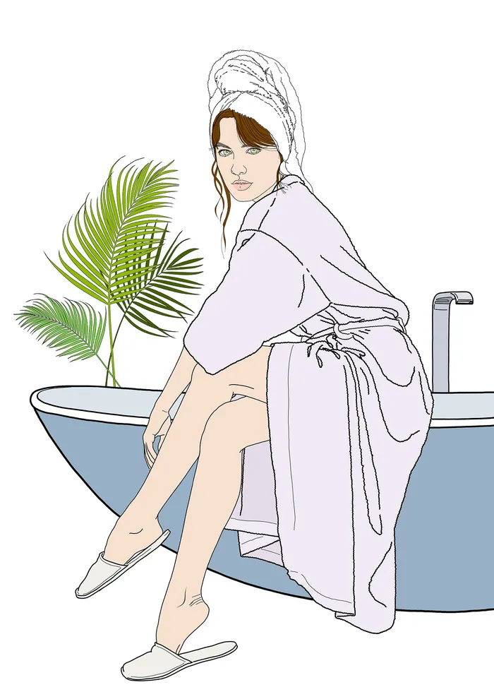 Woman in bathrobe sitting on bathtub with towel on head by palm leaf by Montana Forbes