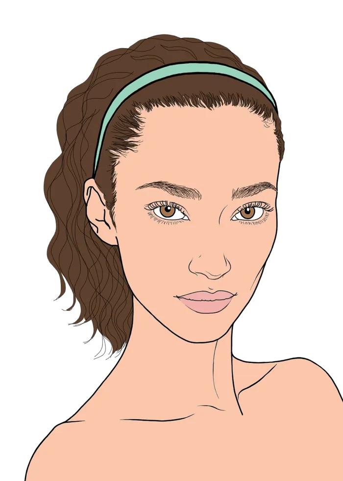 Portrait of young woman with brown hair and green headband