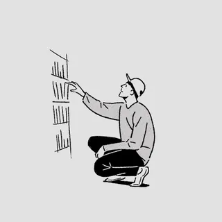 Person kneeling and placing files on a shelf