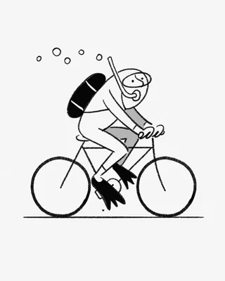 Scuba diver with snorkel riding a bicycle with bubbles