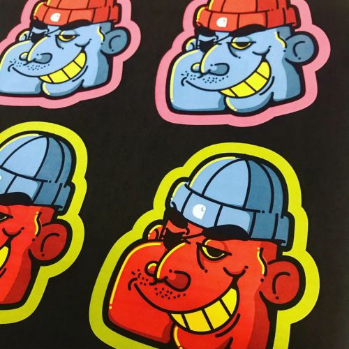 Colorful cartoon stickers with grinning faces wearing hats