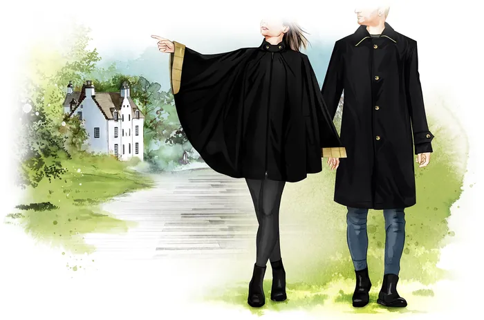 Couple in black coats holding hands beside a path and house by Natalia Sanabria