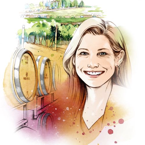 Smiling woman with wine barrels and vineyard scenery