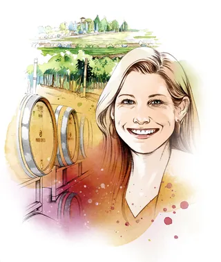 Smiling woman with wine barrels and vineyard scenery