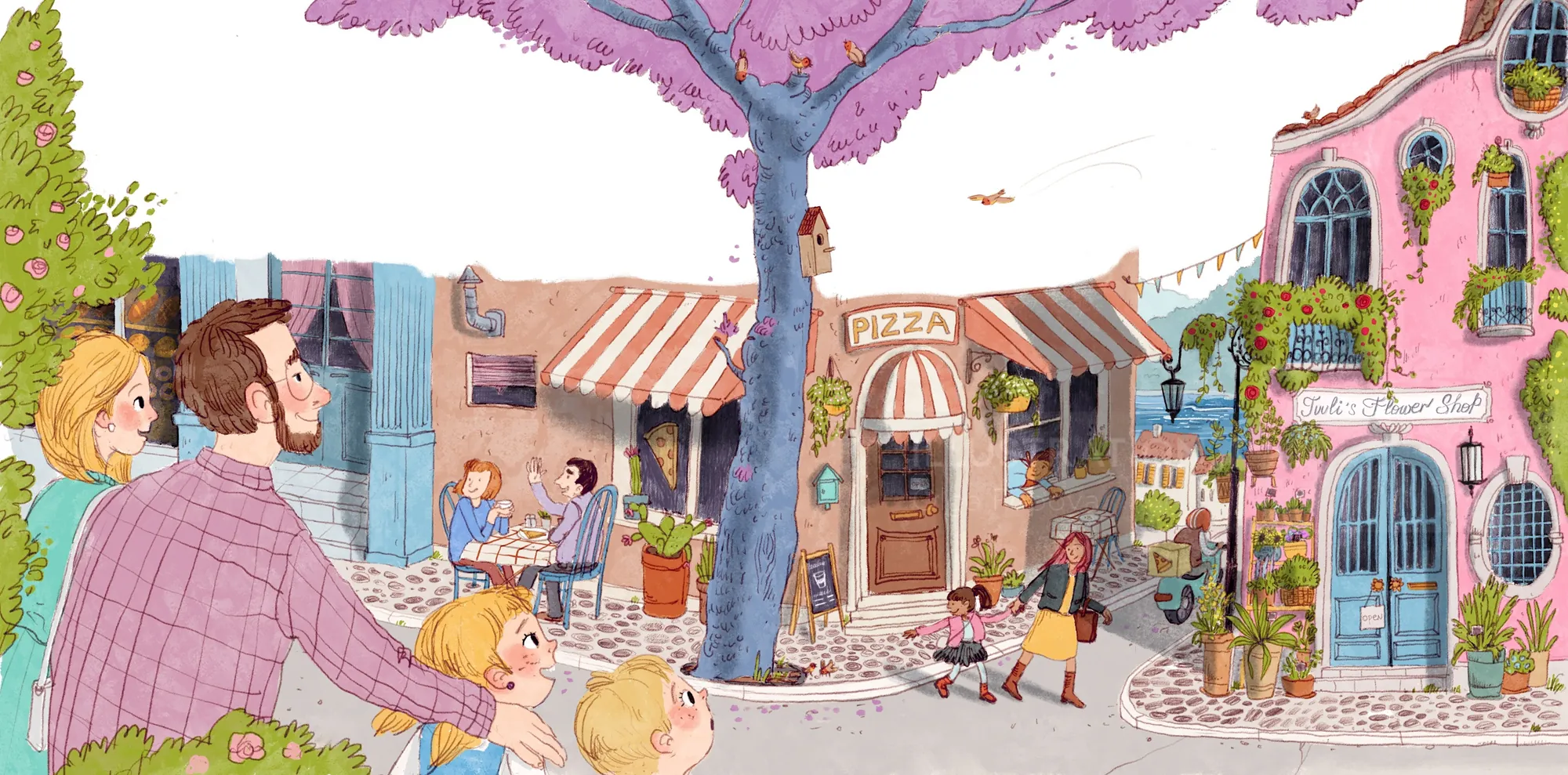 Colorful street with families, cafes, and a large pink tree