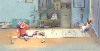 Child sitting on floor looking thoughtful, cat standing by door