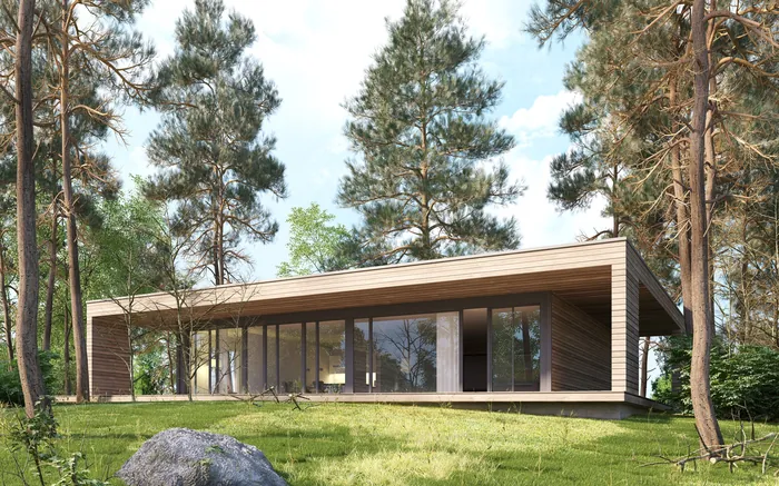 Modern glass house surrounded by pine trees in forest landscape by Oliver Hasselluhn