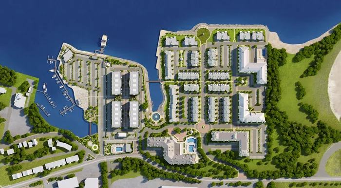 Aerial view of coastal residential complex showing buildings and water, by Oliver Hasselluhn