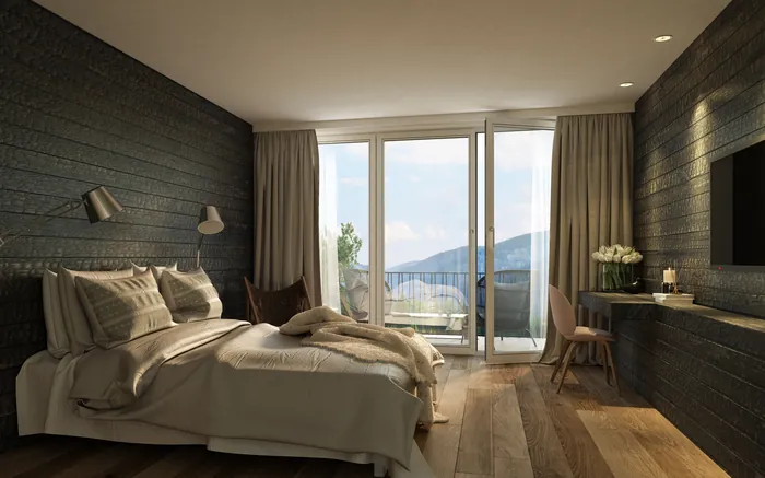 Modern bedroom with bed and mountain view balcony by Oliver Hasselluhn